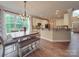 Spacious breakfast nook with light wood table and bench seating at 8100 Avanti Dr, Waxhaw, NC 28173