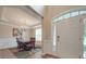 Formal dining room with hardwood floors, chandelier, and wainscoting at 8100 Avanti Dr, Waxhaw, NC 28173