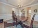 Formal dining room with hardwood floors, chandelier and wainscoting at 8100 Avanti Dr, Waxhaw, NC 28173