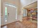 Bright entryway with hardwood floors and an office to the right at 8100 Avanti Dr, Waxhaw, NC 28173