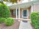 Brick front porch with columns, a bench, and lush landscaping at 8100 Avanti Dr, Waxhaw, NC 28173