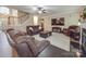 Bright living room with hardwood floors and a view of the staircase at 8100 Avanti Dr, Waxhaw, NC 28173