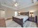 Spacious main bedroom with wood floors and ensuite bath at 8100 Avanti Dr, Waxhaw, NC 28173