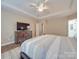 Main bedroom with dresser and access to the bathroom at 8100 Avanti Dr, Waxhaw, NC 28173