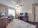 Functional home office with wood desk and comfortable seating at 8100 Avanti Dr, Waxhaw, NC 28173