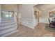 Elegant staircase with a gray carpet runner and wood railings at 8100 Avanti Dr, Waxhaw, NC 28173