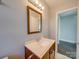 Updated bathroom with vanity, mirror, and single sink at 811 Colonial Dr, Rock Hill, SC 29730