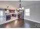 Spacious dining room adjacent to kitchen, featuring hardwood floors at 811 Colonial Dr, Rock Hill, SC 29730