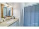 Small bathroom with granite vanity and shower/tub combo at 8191 Deep Water Ln, Denver, NC 28037