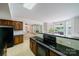 Lakefront kitchen with granite counters and stainless steel appliances at 8191 Deep Water Ln, Denver, NC 28037