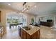 Open kitchen and dining area with lake views, island, and breakfast bar at 8191 Deep Water Ln, Denver, NC 28037