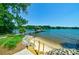 Private sandy beach access with wooden steps at 8191 Deep Water Ln, Denver, NC 28037