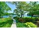 Landscaped yard with walkway to lake and private dock at 8191 Deep Water Ln, Denver, NC 28037