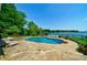 Inviting pool with spa and lake views at 8191 Deep Water Ln, Denver, NC 28037