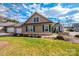 Tan house with green shutters, stone accents, and a landscaped lawn at 823 Wynnshire Dr # C, Hickory, NC 28601