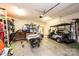 Attached garage with golf cart, ample storage shelving, and workbenches at 823 Wynnshire Dr # C, Hickory, NC 28601