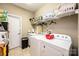 Laundry room with washer, dryer, and ample shelving at 823 Wynnshire Dr # C, Hickory, NC 28601