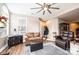 Living room with hardwood floors, ceiling fan, and ample natural light at 823 Wynnshire Dr # C, Hickory, NC 28601