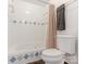 Bathroom with tub and shower, and updated tile at 8406 Tifton Rd, Charlotte, NC 28226