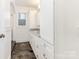 Bathroom with double vanity and dark tile floors at 8406 Tifton Rd, Charlotte, NC 28226