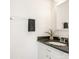 Bathroom with granite countertop, white vanity, and modern fixtures at 8406 Tifton Rd, Charlotte, NC 28226