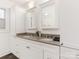 Double vanity bathroom with white cabinets at 8406 Tifton Rd, Charlotte, NC 28226