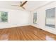 Bright bedroom with hardwood floors and multiple windows at 8406 Tifton Rd, Charlotte, NC 28226