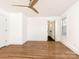 Bright bedroom with hardwood floors and ceiling fan at 8406 Tifton Rd, Charlotte, NC 28226