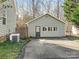 Detached garage with a single door and window at 8406 Tifton Rd, Charlotte, NC 28226