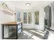 Kitchen island with butcher block countertop and view to backyard at 8406 Tifton Rd, Charlotte, NC 28226