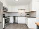 Renovated kitchen with stainless steel appliances and white shaker cabinets at 8406 Tifton Rd, Charlotte, NC 28226