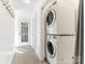 Stackable washer and dryer in a small laundry area at 8406 Tifton Rd, Charlotte, NC 28226