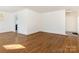 Hardwood floors and bright living area with access to other rooms at 8406 Tifton Rd, Charlotte, NC 28226