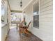 Charming front porch with wooden chairs, ideal for relaxing at 8406 Tifton Rd, Charlotte, NC 28226