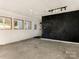 Large workshop featuring a chalkboard wall and ceiling fan at 8406 Tifton Rd, Charlotte, NC 28226