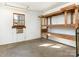 Spacious workshop with wooden shelving units at 8406 Tifton Rd, Charlotte, NC 28226