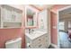 Updated bathroom with pink walls and walk-in shower at 8708 Sweet Sage Ln, Charlotte, NC 28227