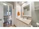 Simple bathroom with a single sink and built-in storage at 8708 Sweet Sage Ln, Charlotte, NC 28227