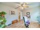 Home office with hardwood floors, built-in shelving and a view of the upper floor at 8708 Sweet Sage Ln, Charlotte, NC 28227