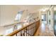 Upstairs hallway with wood floors and access to bedrooms at 8708 Sweet Sage Ln, Charlotte, NC 28227