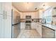 Modern kitchen featuring white cabinets, stainless steel appliances, and granite countertops at 8708 Sweet Sage Ln, Charlotte, NC 28227