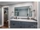 Double vanity bathroom with modern gray cabinets at 910 S College Ave, Newton, NC 28658