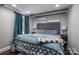 Bedroom with king-size bed and teal bedding at 910 S College Ave, Newton, NC 28658