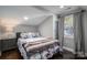 Cozy bedroom with a double bed and gray accents at 910 S College Ave, Newton, NC 28658