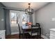 Bright dining area with hardwood floors and view from windows at 910 S College Ave, Newton, NC 28658