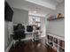 Home office with dark wood floors, a large monitor, and a cat tree at 910 S College Ave, Newton, NC 28658