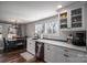 Modern white kitchen with stainless steel appliances and quartz countertops at 910 S College Ave, Newton, NC 28658