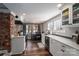 Updated kitchen featuring white cabinetry and stainless steel appliances at 910 S College Ave, Newton, NC 28658