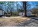 Landscaped side yard with walkway to the garage at 910 S College Ave, Newton, NC 28658