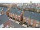 Aerial view of brick townhomes with garages and nearby amenities at 9223 Belcaro Ln, Charlotte, NC 28273